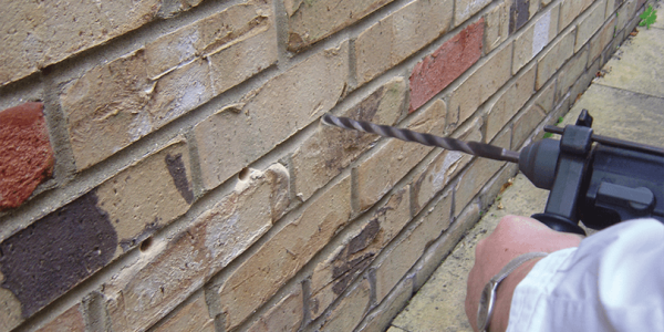 1. 12mm diameter holes drilled horizontally into the mortar joint at 120mm centres and to a depth of 10 - 20mm from the opposite face.